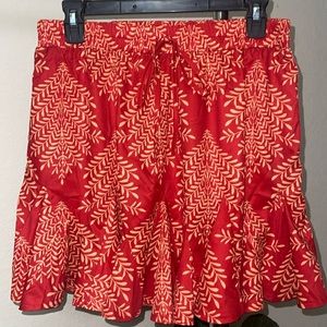Red/orange CUPSHE mini skirt size L with drawstring waist, never worn.